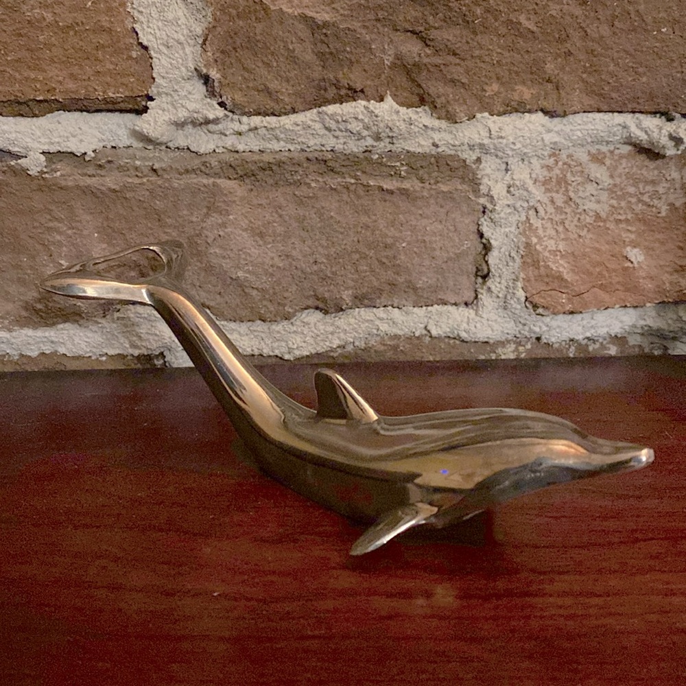 Vintage dolphin bottle opener. Silver coloured.